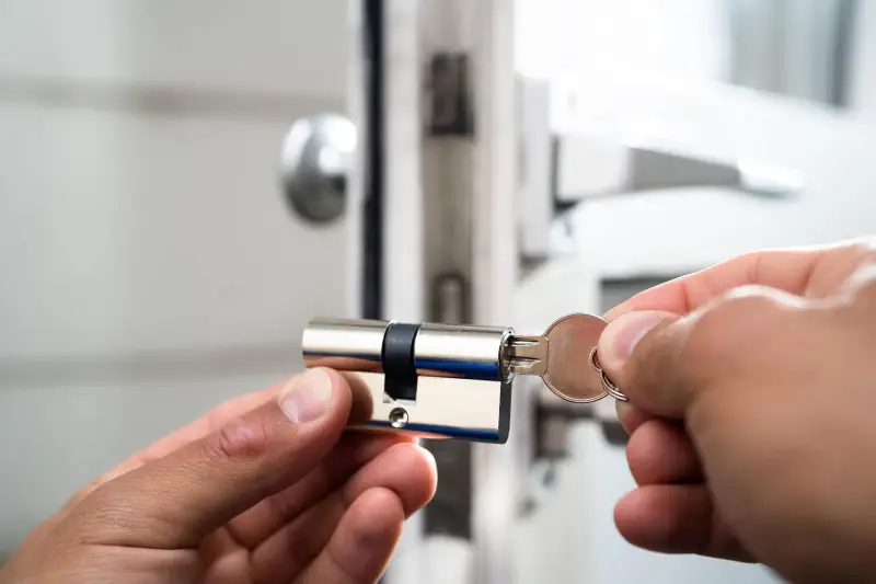 Image related to commercial lock services in Port Credit, possibly showcasing a professional locksmith working on a commercial door lock installation or repair. by Mississauga Locksmiths  Image related to commercial lock services in Port Credit, possibly showcasing a professional locksmith working on a commercial door lock installation or repair. by Mississauga Locksmiths